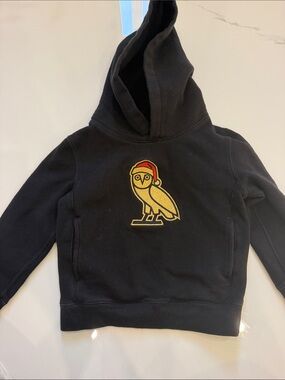 OVO Kids Black Hoodie with Gold Owl Patch and Red Accent